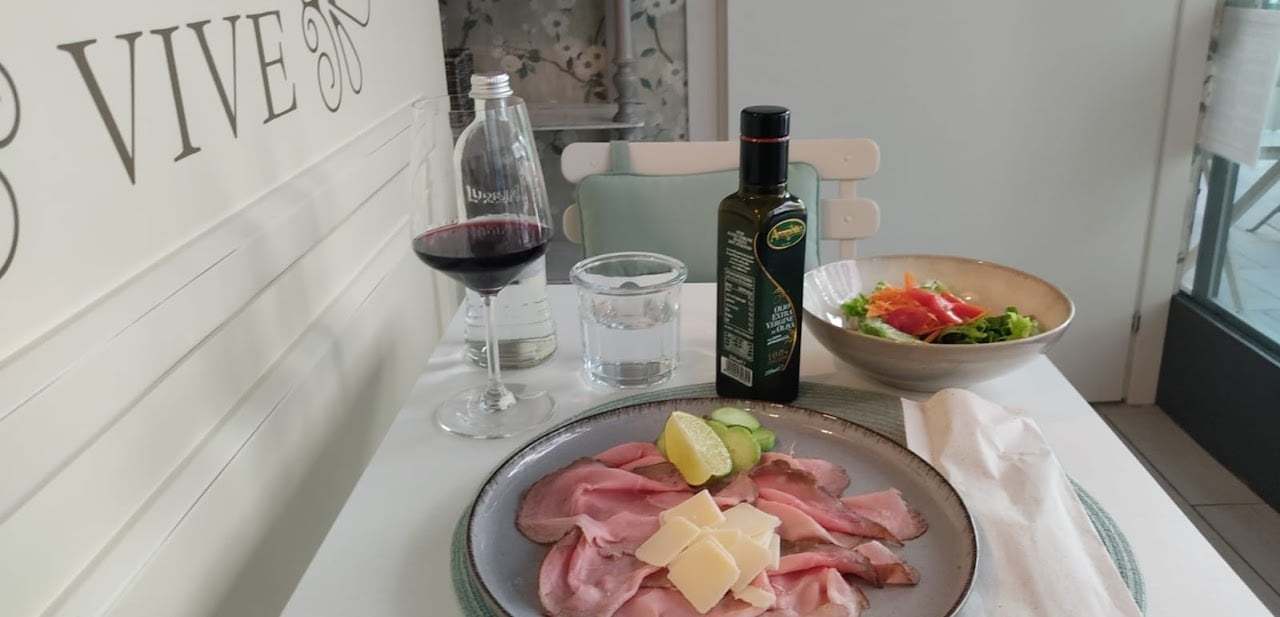 A platter at Bistrot Vivè with a glass of wine